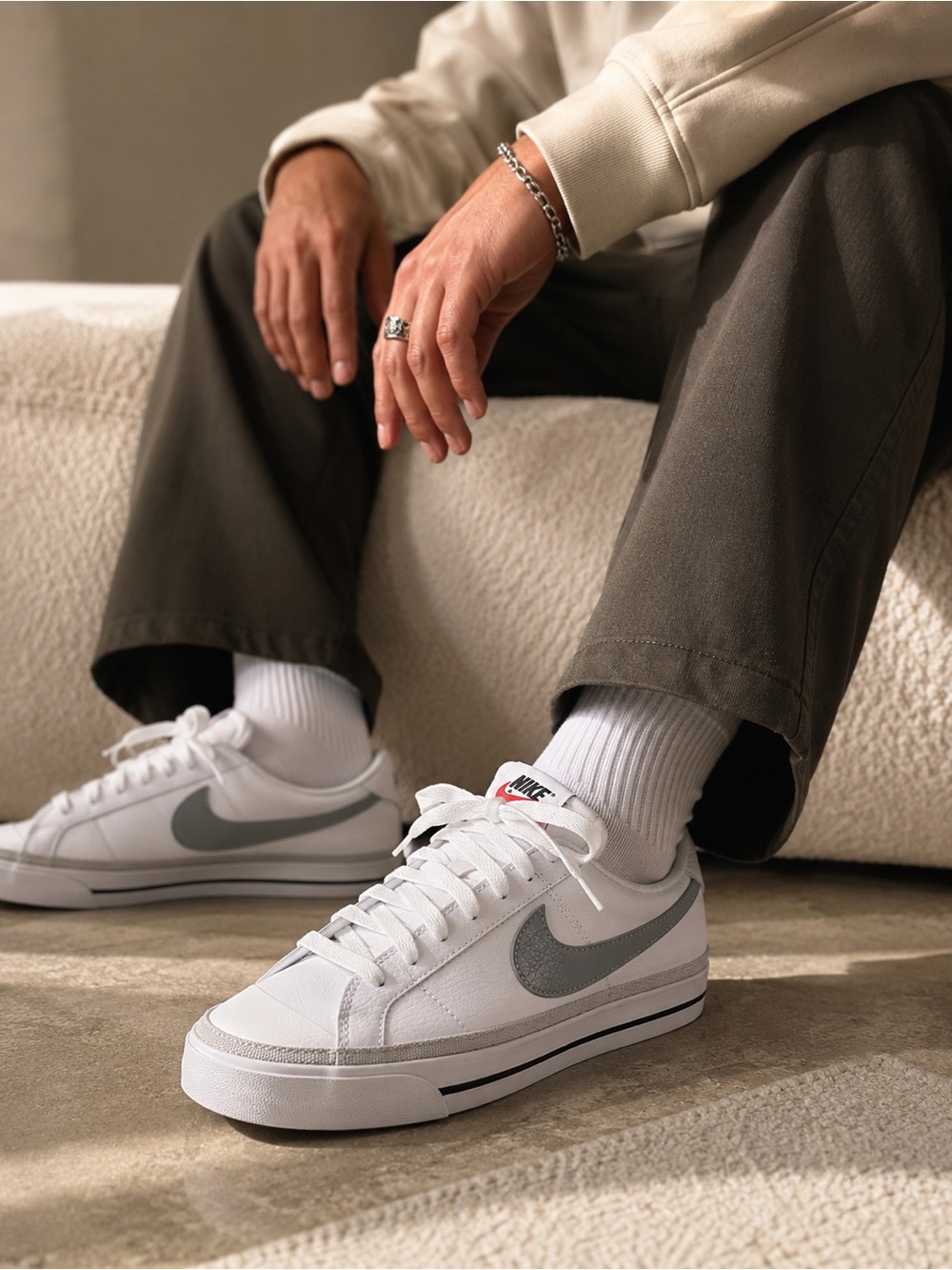 Nike Court Legacy Low Top White Sneakers with Silver Swoosh Accent